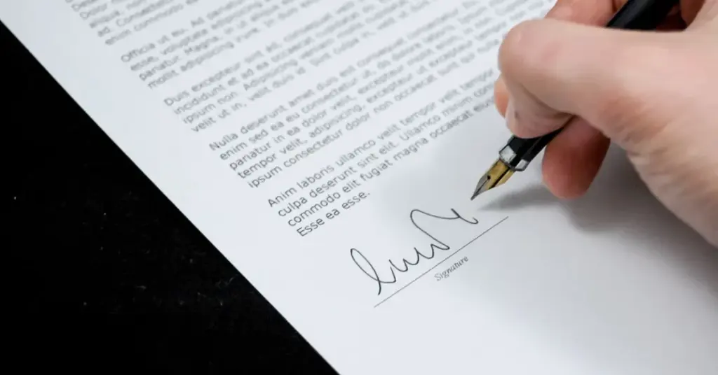 Person writing a cover letter for a visa application