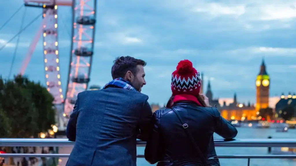 Romantic London couples guide Primrose Hill sunset skyline view couple champagne picnic evening city lights