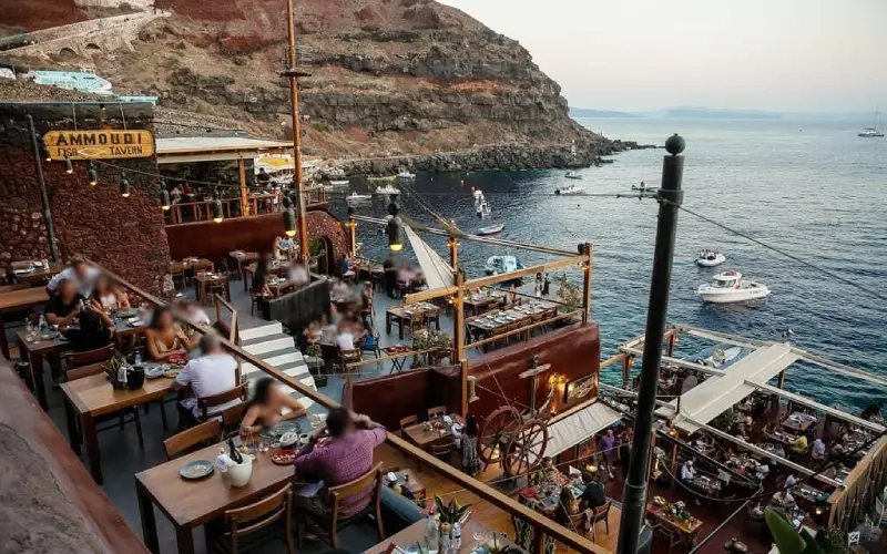 Seaside dinner at Ammoudi Bay in Santorini with waterfront seafood restaurants and sunset views