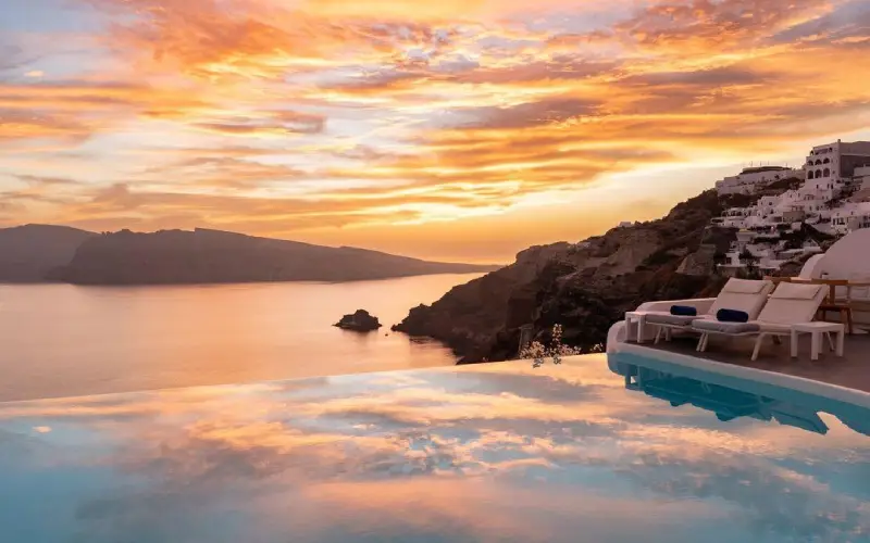 Katikies Hotel in Oia Santorini with whitewashed suites and infinity pools overlooking the caldera