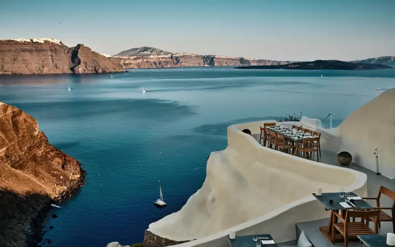 Mystique Hotel in Oia Santorini with luxury cave suites, infinity pools and stunning caldera views