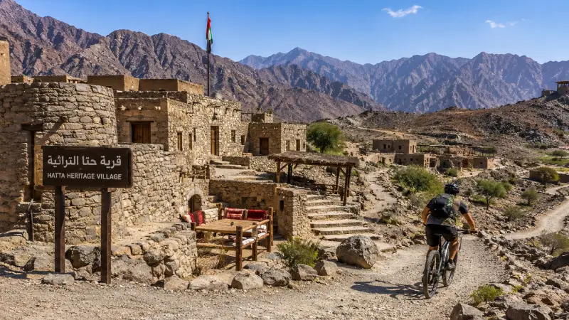 Hatta Heritage Village traditional stone architecture and Hatta Wadi Hub mountain biking trails Dubai road trip