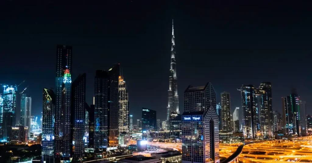Dubai Travel Package Burj Khalifa illuminated against the Dubai skyline at night