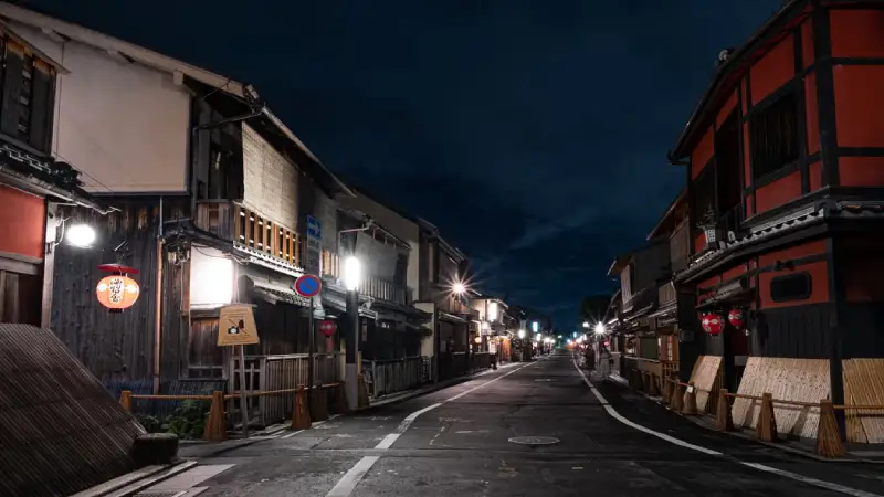 Traditional wooden buildings and lanterns along a street in Kyoto's Gion district