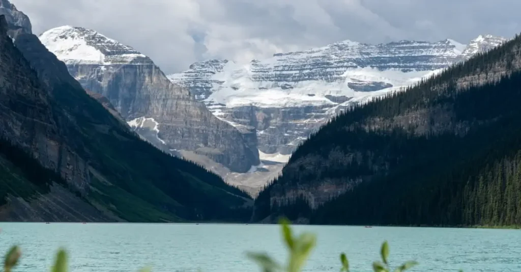 Turquoise waters of Lake Louise surrounded by mountains in Banff National Park