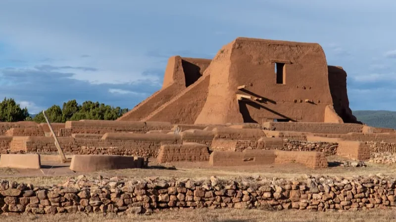 Adobe style buildings in Santa Fe New Mexico with mountains in the background
