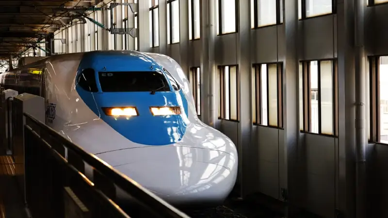 Shinkansen bullet train arriving at Nagano Station in Japan