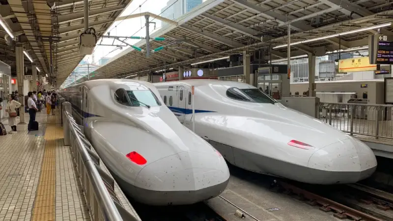Shinkansen bullet train departing Shin-Osaka Station platform