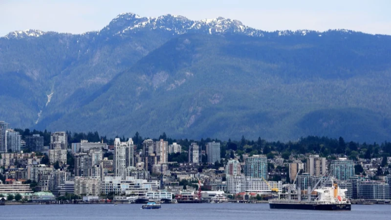 Vancouver skyline with mountains rising behind the harbor