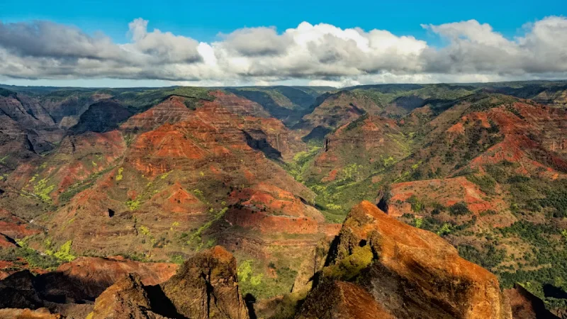 Colorful canyon walls and lush green valleys at Waimea Canyon in Kauai 