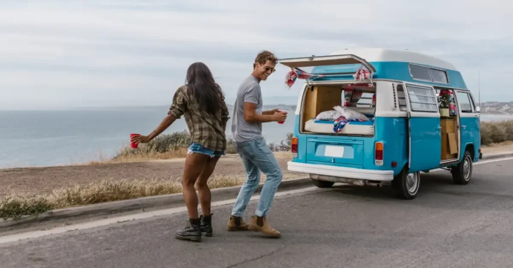 Backpacker campervan driving along a coastal road on Australia's East Coast