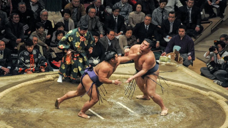 Sumo wrestlers training at a stable in Japan early in the morning 