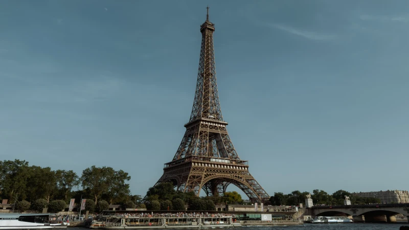 The Eiffel Tower rising above the Seine River in Paris