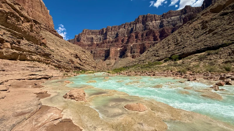 Rafters navigating the Colorado River through the Grand Canyon 