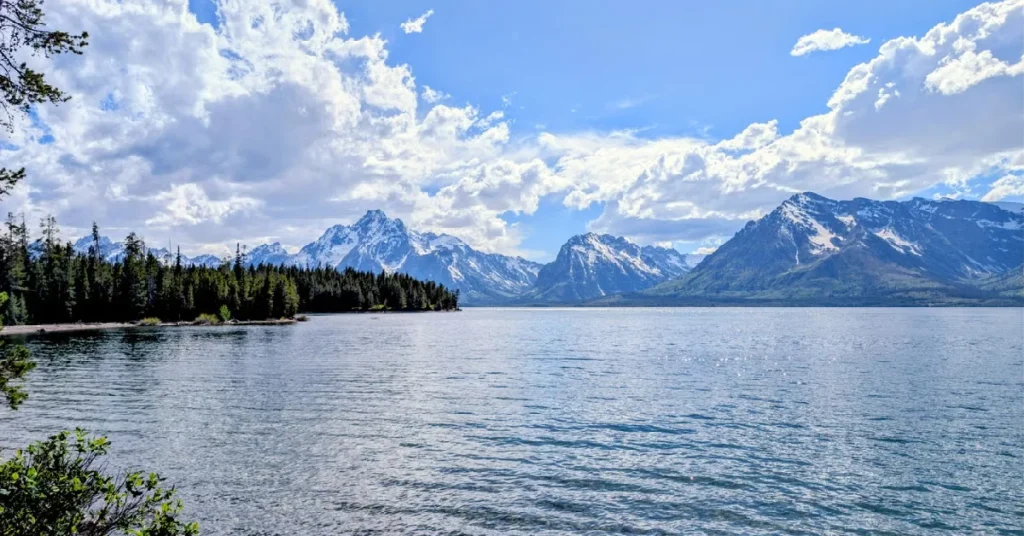 Grand Teton mountains reflected in the still water of Jenny Lake
