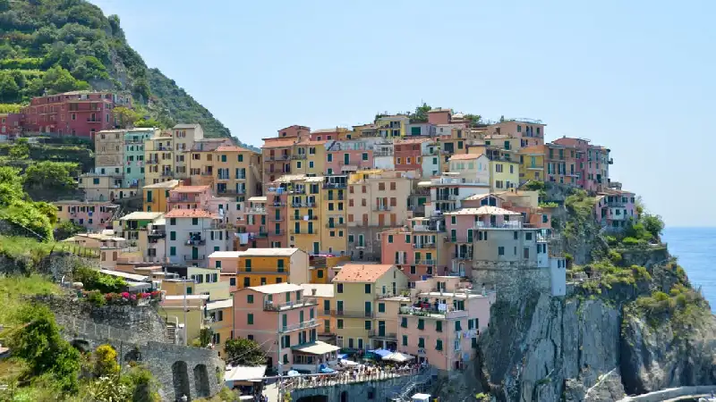 Colourful houses built into the cliffside in Manarola, Cinque Terre