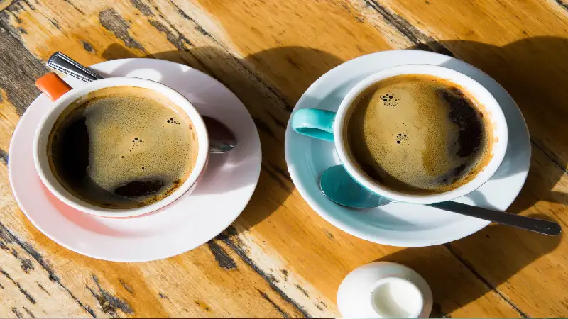 Couple sharing coffee at a laneway cafe in Melbourne