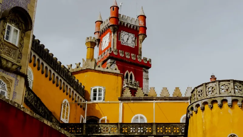 The vividly colored Pena Palace on a hilltop in Sintra, Portugal