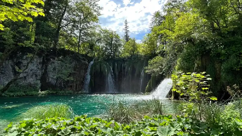 Turquoise lakes and waterfalls connected by boardwalks in Plitvice Lakes National Park